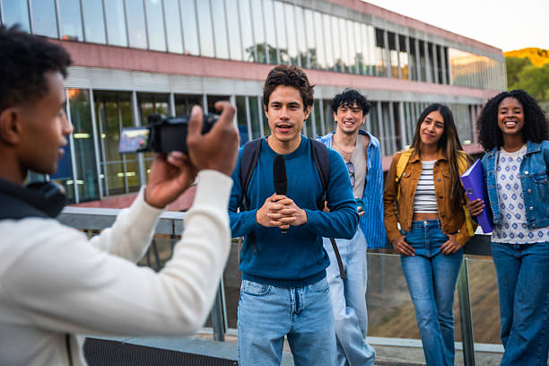 istock University students vlogging on campus, filming interview for college project 2237658786