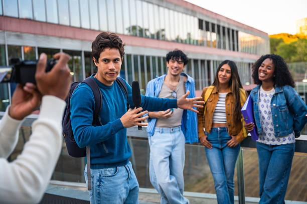 Students recording interview for university media channel