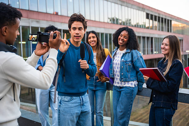 istock University students recording a vlog on campus 2237658796