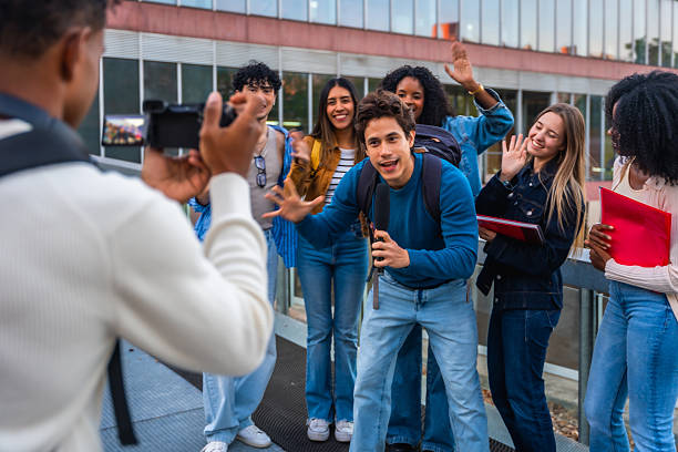 istock University students vlogging on campus, creating social media content 2237658803