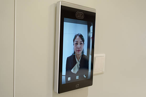 istock Asian woman using facial recognition system 2237659175