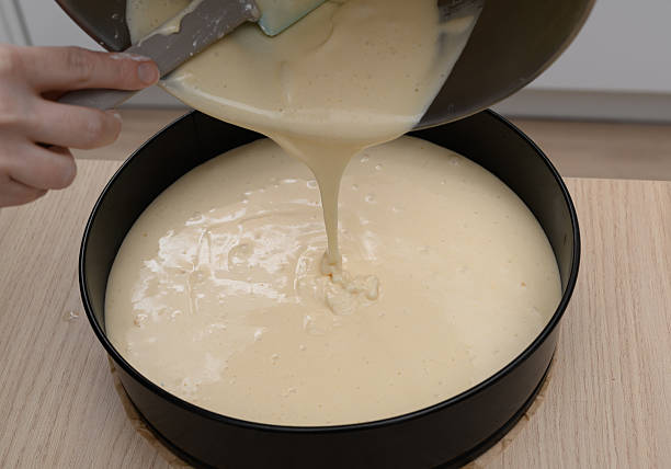 istock Make the cheesecake, pour the mixed ingredients into a round cake tin 2237660124