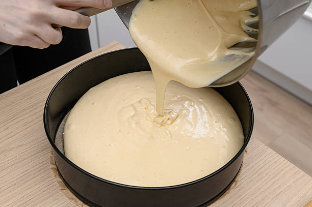 istock Make a sponge cake, pour the fluffy raw dough into a cake tin 2237660134