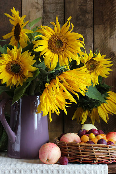 A simple but luxurious interior decorated with bright full sunflowers in a modern dinning room.