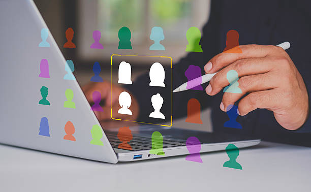 istock Niche marketing and personalization concept. Marketing segmentation strategy and consumer analysis. Marketer using laptop computer to analyze target customer data. 2237662287