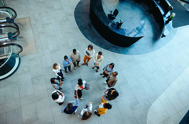 istock Overhead view of diverse group handshake in modern office lobby 2237663923
