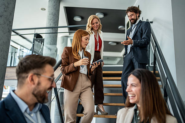 istock Business people having informal discussion on office stairs 2237665777