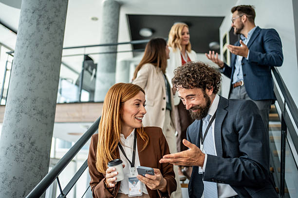 istock Business colleagues networking on stairs during coffee break 2237665880