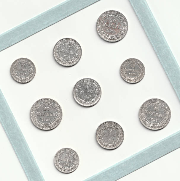 istock A collection of vintage silver coins arranged in a square frame, featuring various denominations and years, showcasing intricate designs and details 2237667211