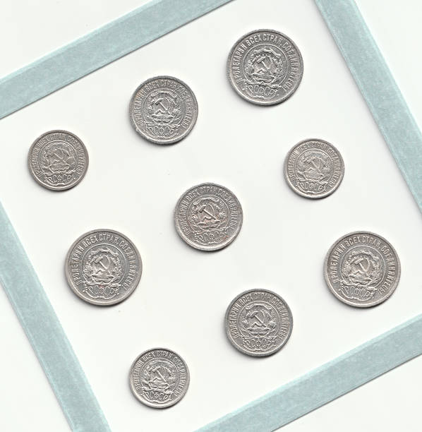 istock A collection of vintage silver coins arranged in a square frame, featuring intricate designs and inscriptions 2237667449