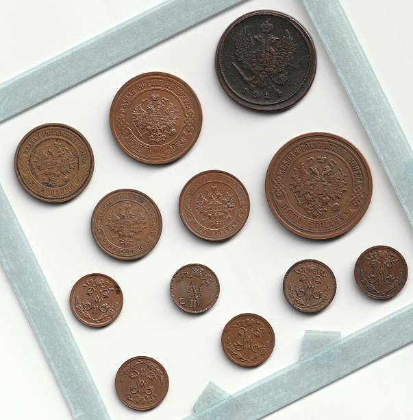 istock A collection of vintage coins displayed in a frame, featuring various designs and sizes, showcasing intricate engravings and historical motifs 2237667460
