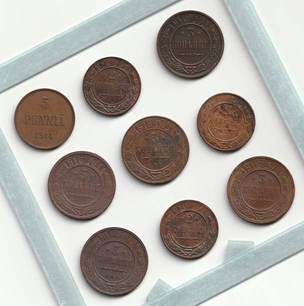istock A collection of vintage coins arranged in a square frame, featuring inscriptions and dates, showcasing their aged patina and historical significance 2237667536