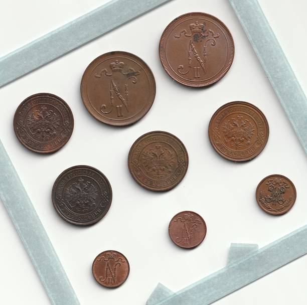 istock A collection of vintage coins displayed in a frame, featuring various sizes and designs, showcasing intricate engravings and historical motifs 2237667547