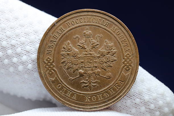istock A vintage russian coin featuring a double-headed eagle emblem, inscribed with russian text and the denomination of one kopeck 2237667692