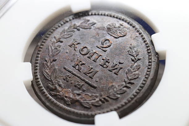istock An old coin featuring inscriptions 2 kopecks, including the denomination and year, encased in a protective holder 2237667721