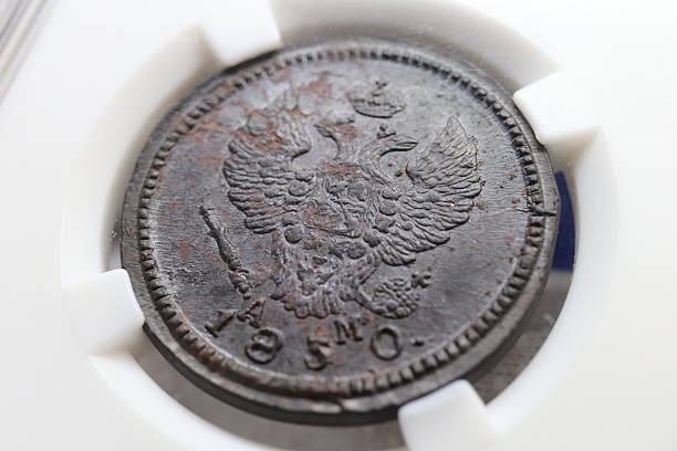 istock An old coin featuring an eagle design, with visible wear and patina, dated 1850 2237667738