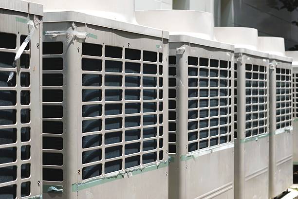 istock Close-up of multiple outdoor air conditioning units (HVAC system) 2237668926