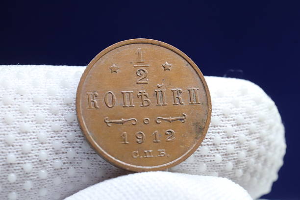 istock A vintage half kopeck coin from 1912, featuring inscriptions in Cyrillic and decorative elements 2237668948