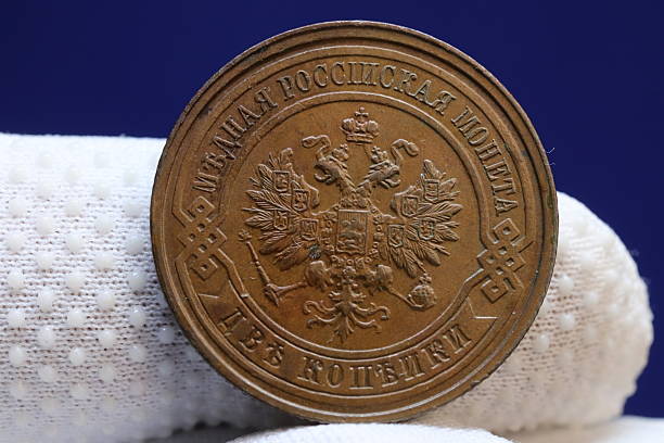 istock A vintage Russian 2 kopecks coin featuring the double-headed eagle emblem, with inscriptions in Russian, displayed on a textured surface 2237669653