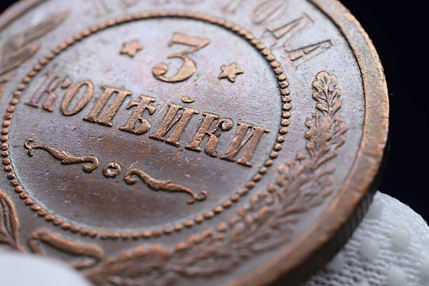 istock A close-up of an old copper coin featuring the denomination '3 ' with decorative elements 2237669724