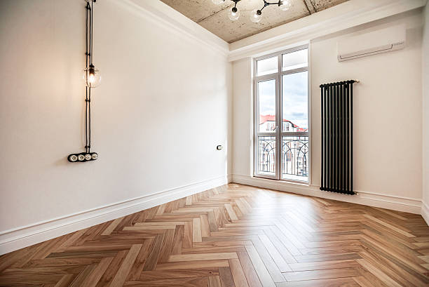 istock A large empty room with a radiator in the corner. New renovation in Loft Style 2237676707