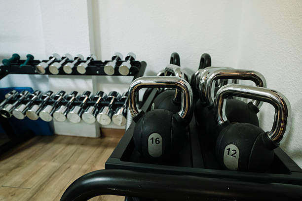 istock A row of dumbbells and a kettlebell are on a rack. 2237683050