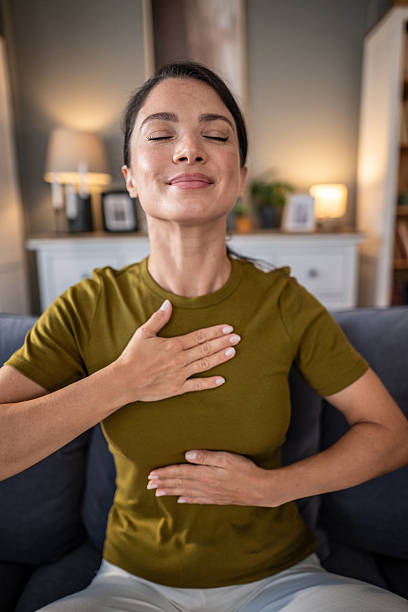 istock Woman practicing deep breathing and mindfulness at home 2237684450
