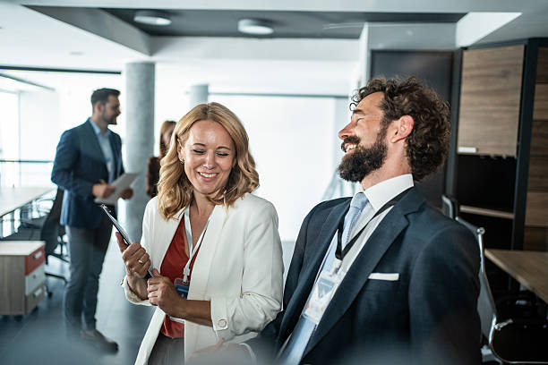 istock Business colleagues networking and laughing in office conference 2237687834