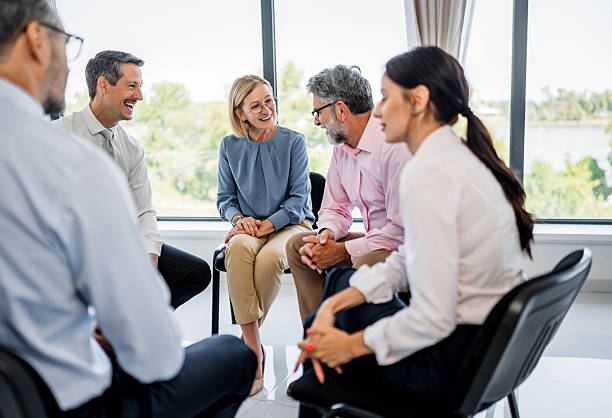 istock Business people engaging in group discussion at meeting 2237689885