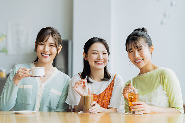 istock Friendly young women having tea in a cafe 2237700249