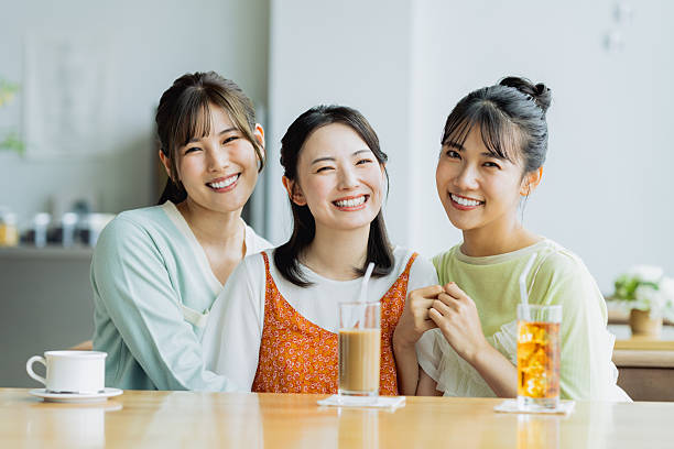 istock Friendly young women having tea in a cafe 2237700255