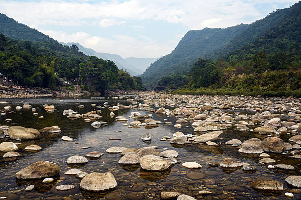 istock Tranquil Mountain River Scene With Pebble Beach, Forest, and Distant Ranges 2237700412