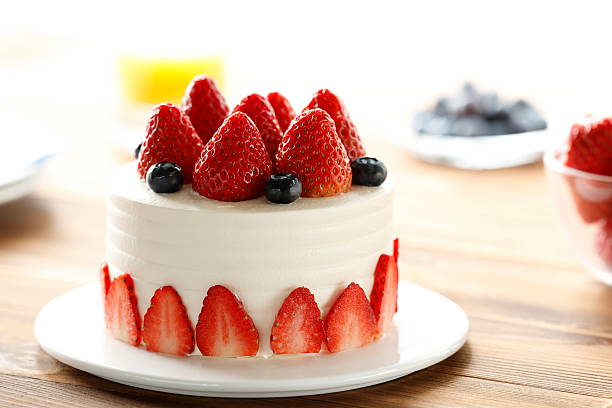 istock Cream Cake Decorated With Stawberries and Blueberries Close-up 2237703145