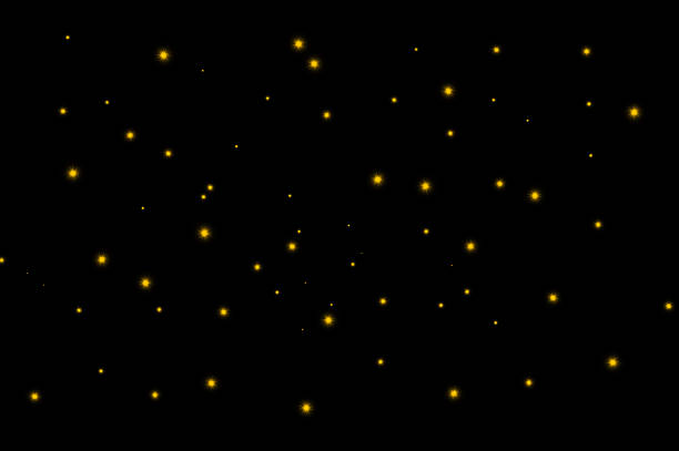 Golden bokeh lights on black background for festive and elegant design