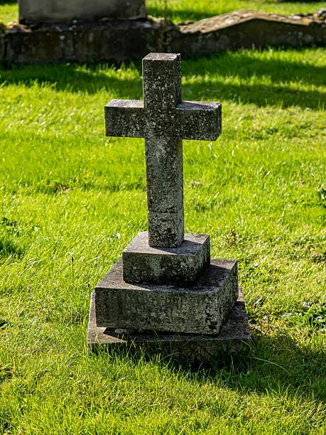 istock Block Cross On Child's Gravestone. 2237704287