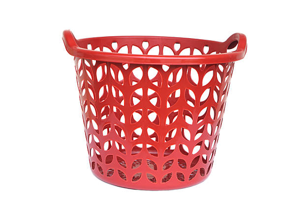 istock Red plastic laundry basket with leaf-shaped cutout design isolated on white background. Household utility container for storing clothes, laundry, or home organization with modern and durable style. 2237704733
