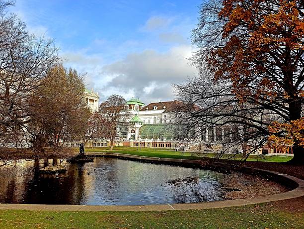 Burggarten City Park in Vienna, Austria, displays vibrant autumn colors as golden leaves frame its historic architecture and tranquil pathways.