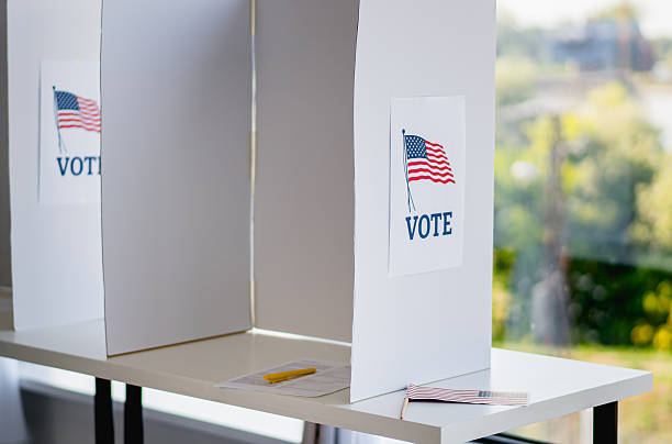 istock Voting booth at polling station with American flag 2237709737