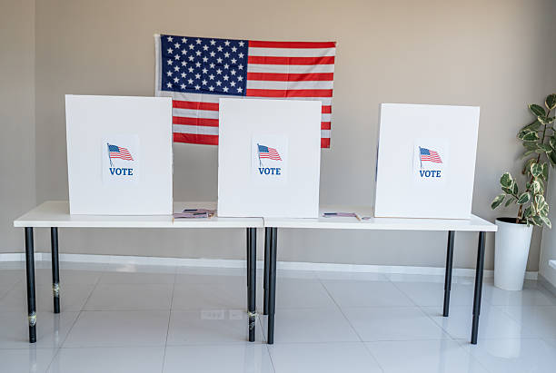 istock Voting booths with American flag demonstrating democratic election process 2237710650