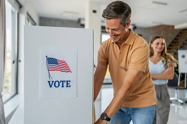 istock Person voting in American election booth 2237710736