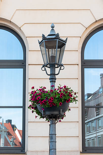 istock Street lamp with hanging flower basket 2237711283