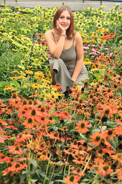 Sitting In A Colorful Flowerbed