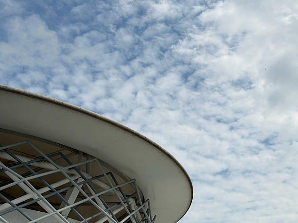 istock Modern circular building roof with cloudy sky background 2237726157