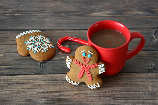 istock a gingerbread biscuits with a red mug of hot chocolate on wooden background 2237731264