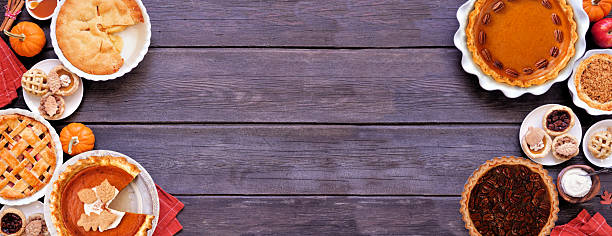 istock Homemade fall pie double border. Top down view on a dark wood banner background. 2237731723