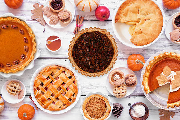 istock Homemade fall pie table scene. Above view on a white wood background. 2237731847