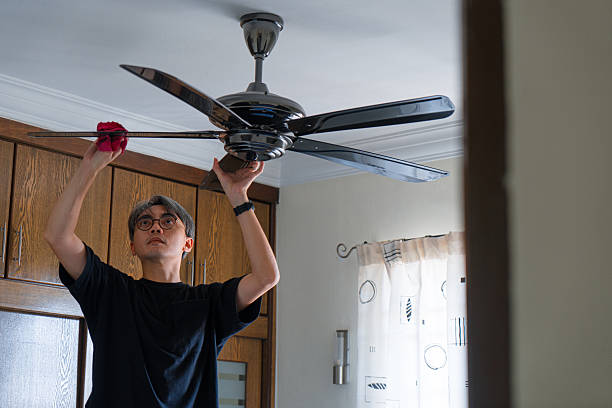 istock Asian Man Cleaning a Ceiling Fan at Home 2237737365