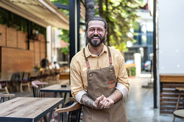 istock Happy cafe owner smiling outside his restaurant 2237740291