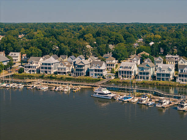 istock New Water Front Coastal Homes - Dock Boats and Boardwalk 2237742166