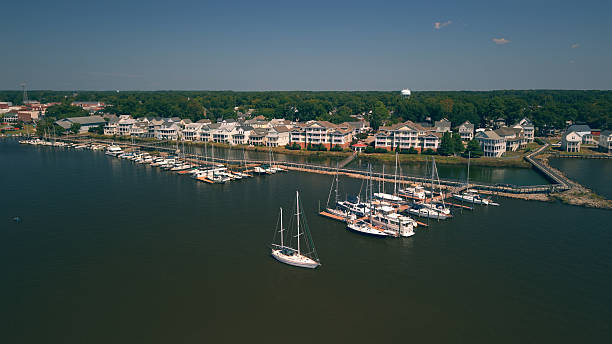 istock New Water Front Coastal Homes - Dock Boats and Boardwalk 2237742252